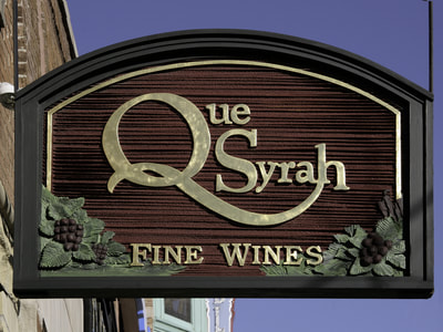 Image of Que Syrah Wine Sign Wells Street, Old Town Signs Chicago,IL, Gold Leaf Signs Chicago, Gold Leaf Lettering, Gold Leaf Signs Milwaukee, Gilded Signs, Gold Leaf Chicago