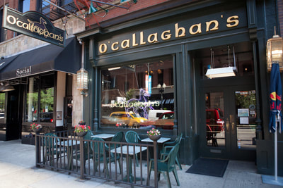 Image shows blade and facade wooden signs O'Callaghan's Chicago, IL